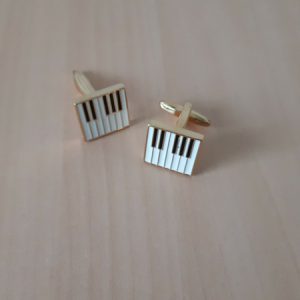 Manchetknopen piano toetsen goudkleurig